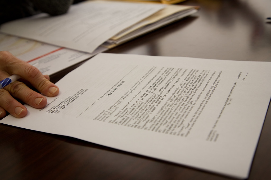 paperwork on a desk requesting a bmc-91 and mcs-90 to meet fmcsa insurance requirements