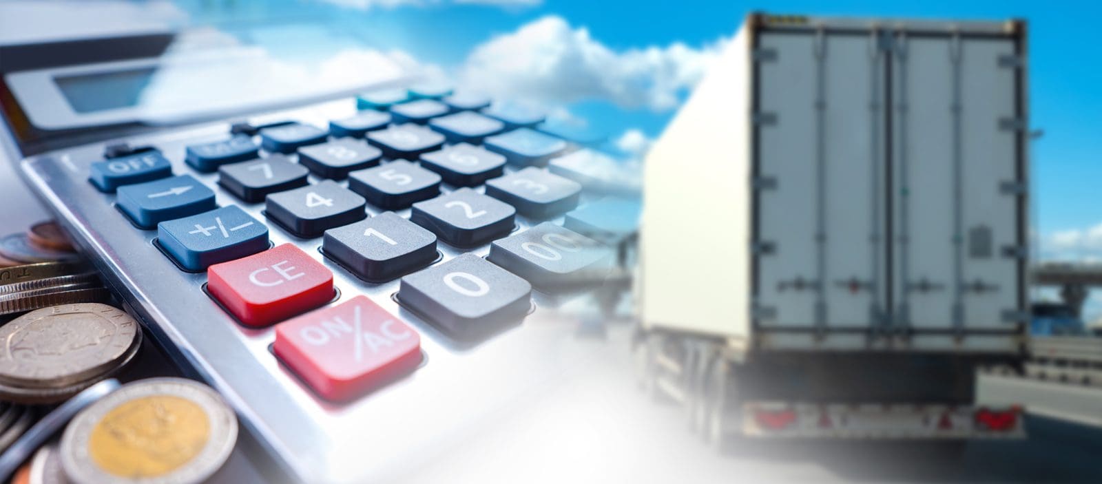 Calculator in front of a truck on the highway, working out cost per mile to decide whether Amazon Relay loads are worth it